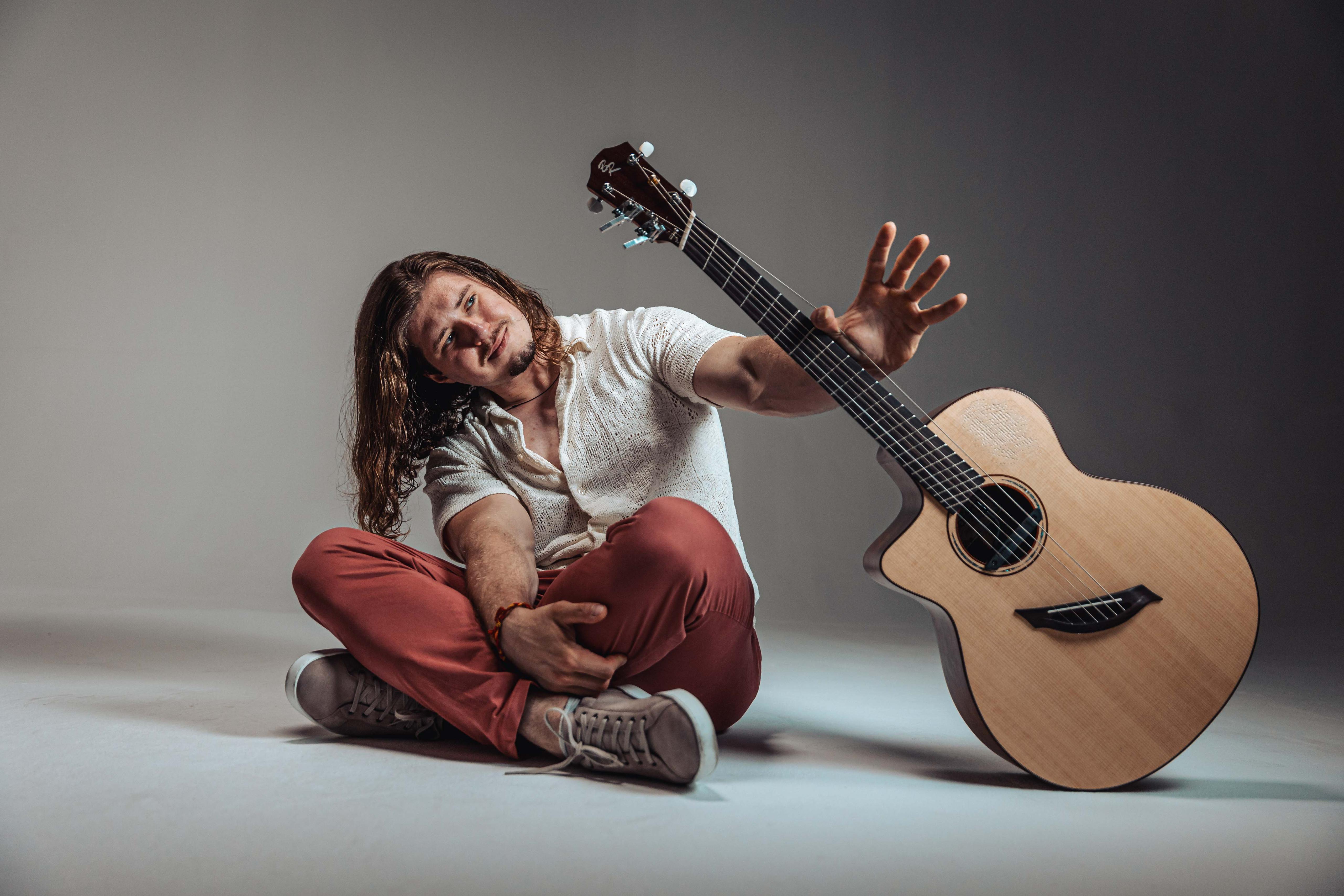 Alexandr Misko signature guitar displayed as the first prize.